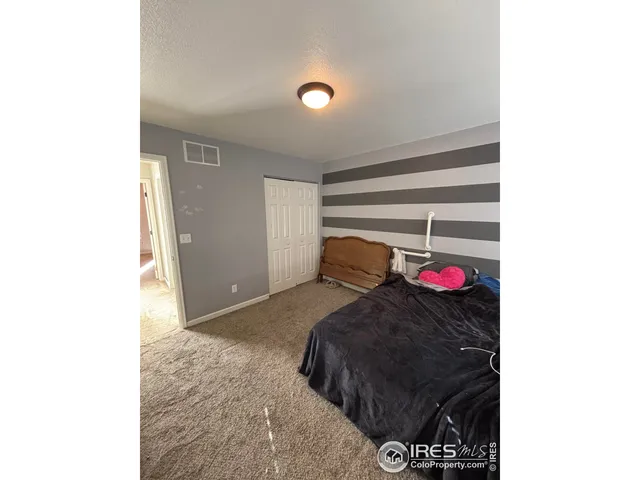 a view of livingroom with furniture and chandelier fan