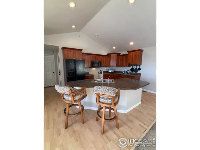 a living room with a couch and a dining table