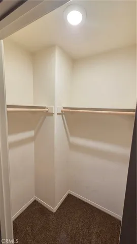 a white toilet sitting next to a bath tub and a shower