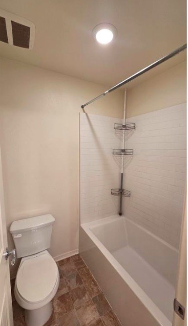 5321 Declan Street Riverside, CA 92504 - Photo 33 of 34 a white toilet sitting next to a bath tub and a shower
