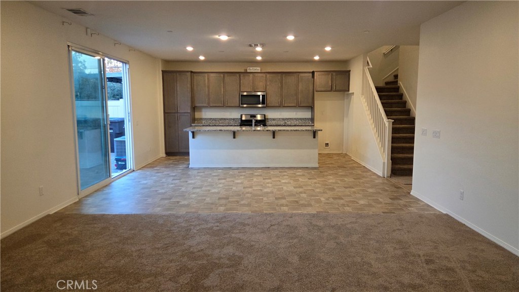 5321 Declan Street Riverside, CA 92504 - Photo 5 of 34 a view of a kitchen with a sink and cabinets