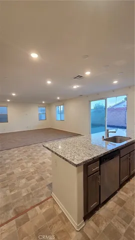a view of an empty room and closet area
