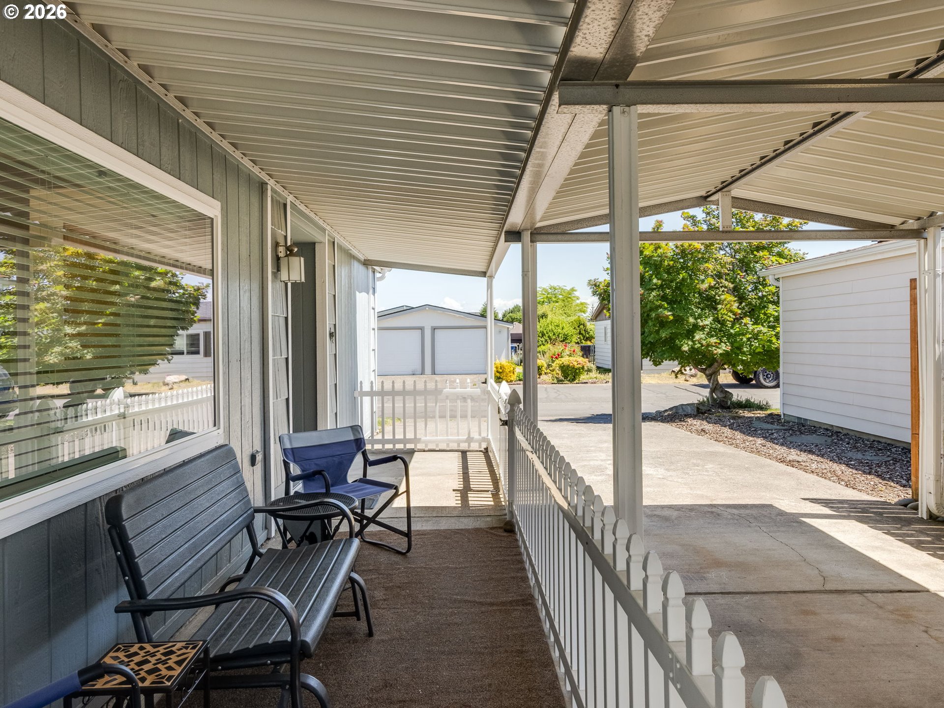4730 Auburn Road Northeast, Unit 125 Salem, OR 97301 - Photo 34 of 36 a balcony with furniture and a potted plant