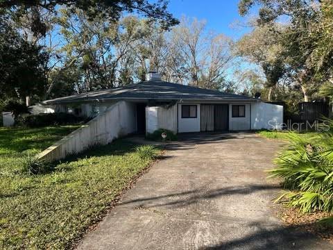 18418 Timberlan Drive Lutz, FL 33549 - Photo 1 of 1 front view of a house with a yard