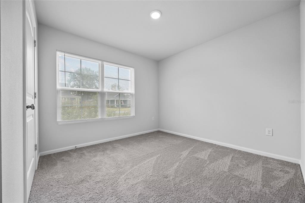 20105 Northwest 247th Street High Springs, FL 32643 - Photo 16 of 26 an empty room with a window
