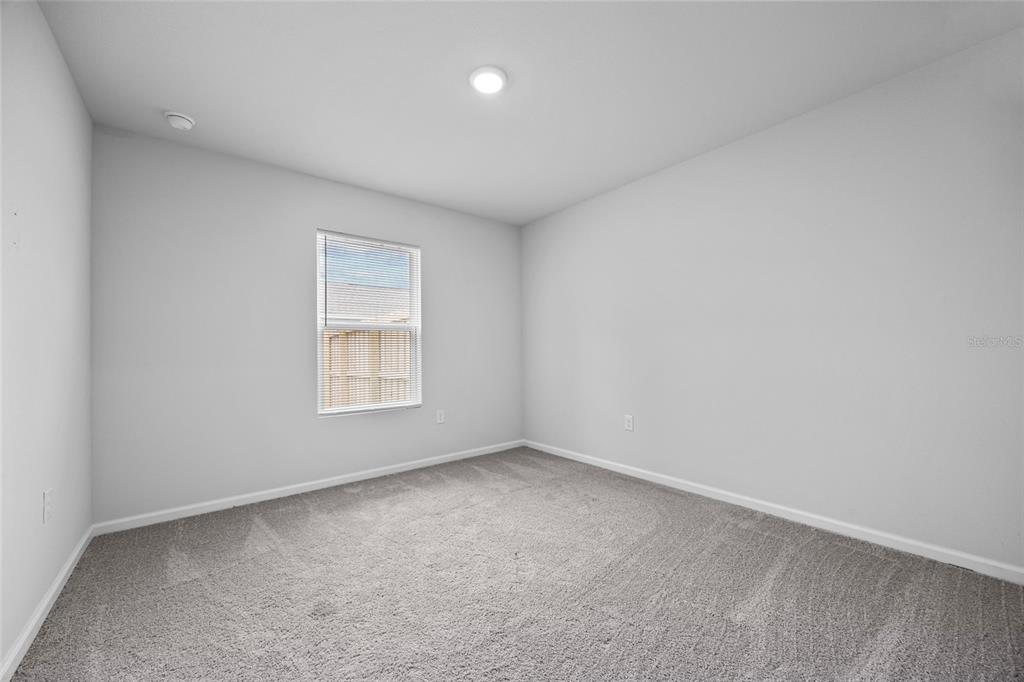 20105 Northwest 247th Street High Springs, FL 32643 - Photo 20 of 26 an empty room with a window