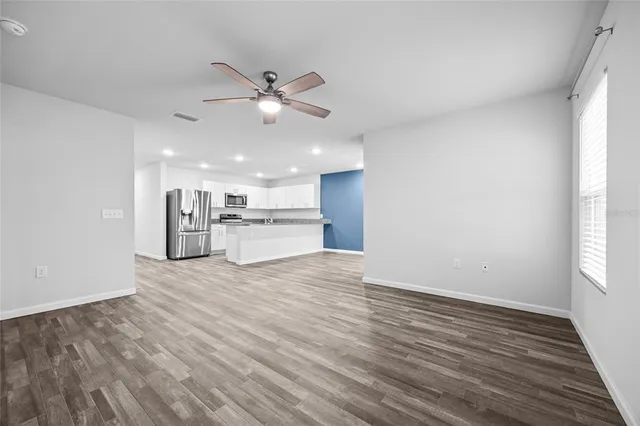 a view of a kitchen with a sink and a window