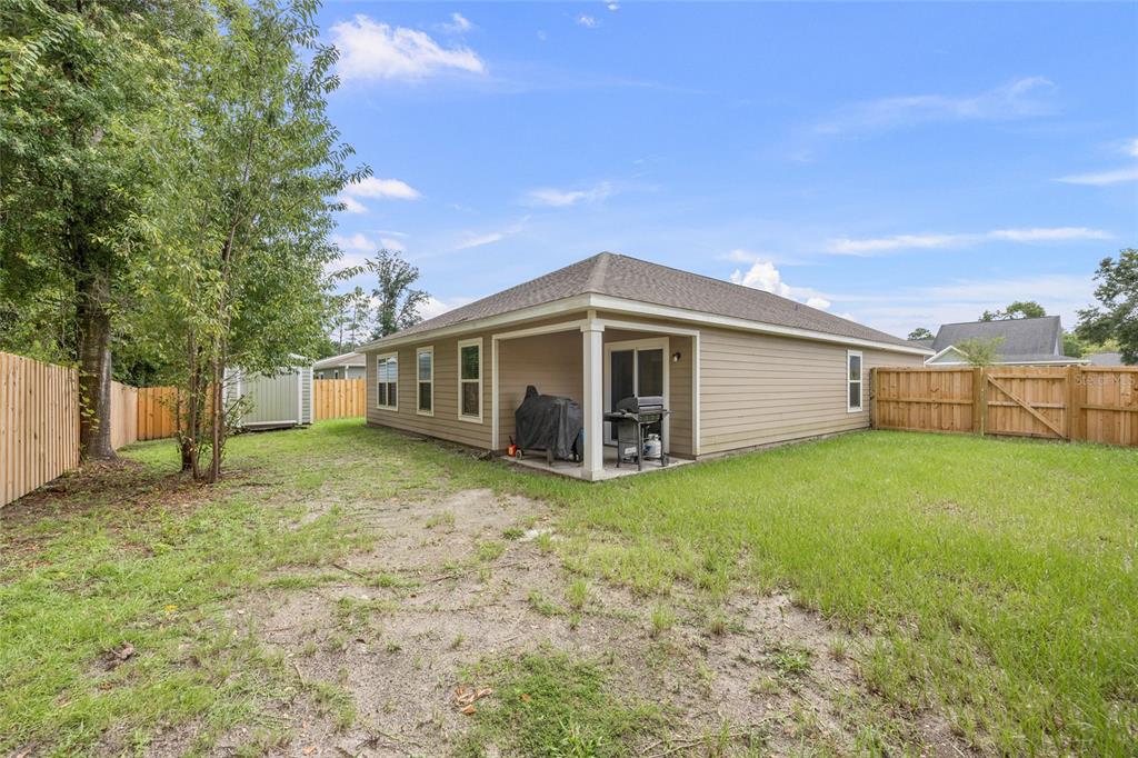 20105 Northwest 247th Street High Springs, FL 32643 - Photo 22 of 26 a view of a house with a backyard