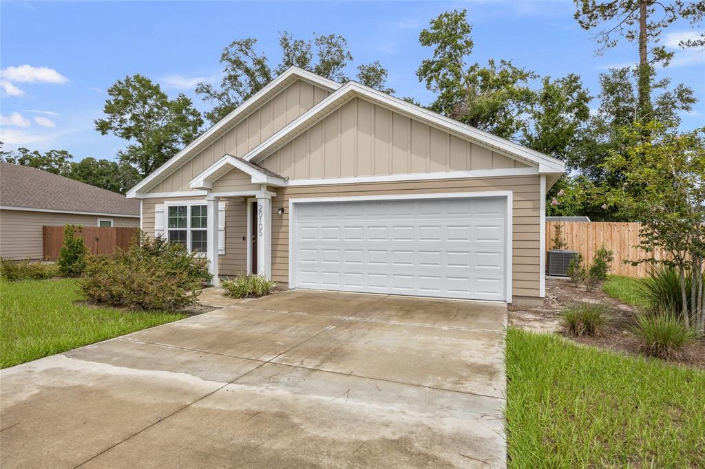 20105 Northwest 247th Street High Springs, FL 32643 - Photo 24 of 26 a view of backyard of house and trees