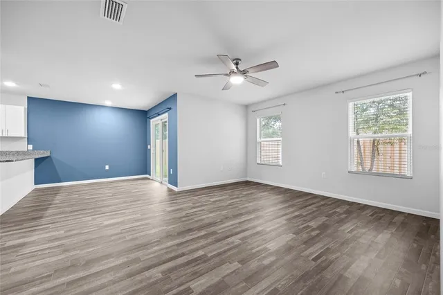 a view of an empty room with a window