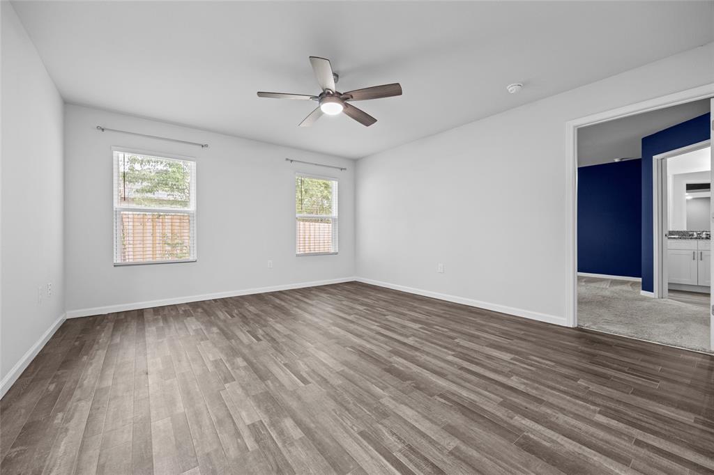 20105 Northwest 247th Street High Springs, FL 32643 - Photo 9 of 26 a view of an empty room with wooden floor and a window