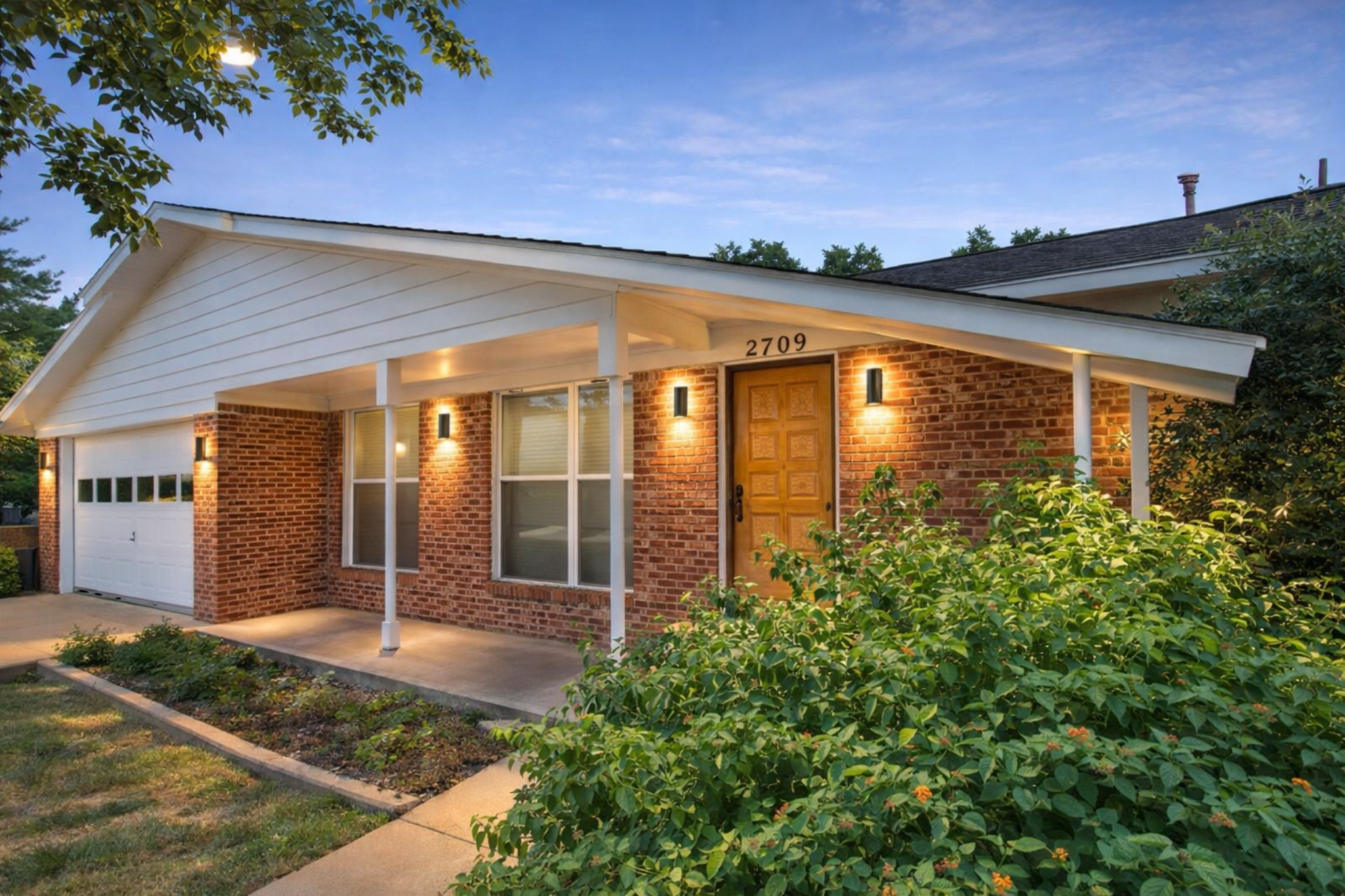 front view of a house with a yard