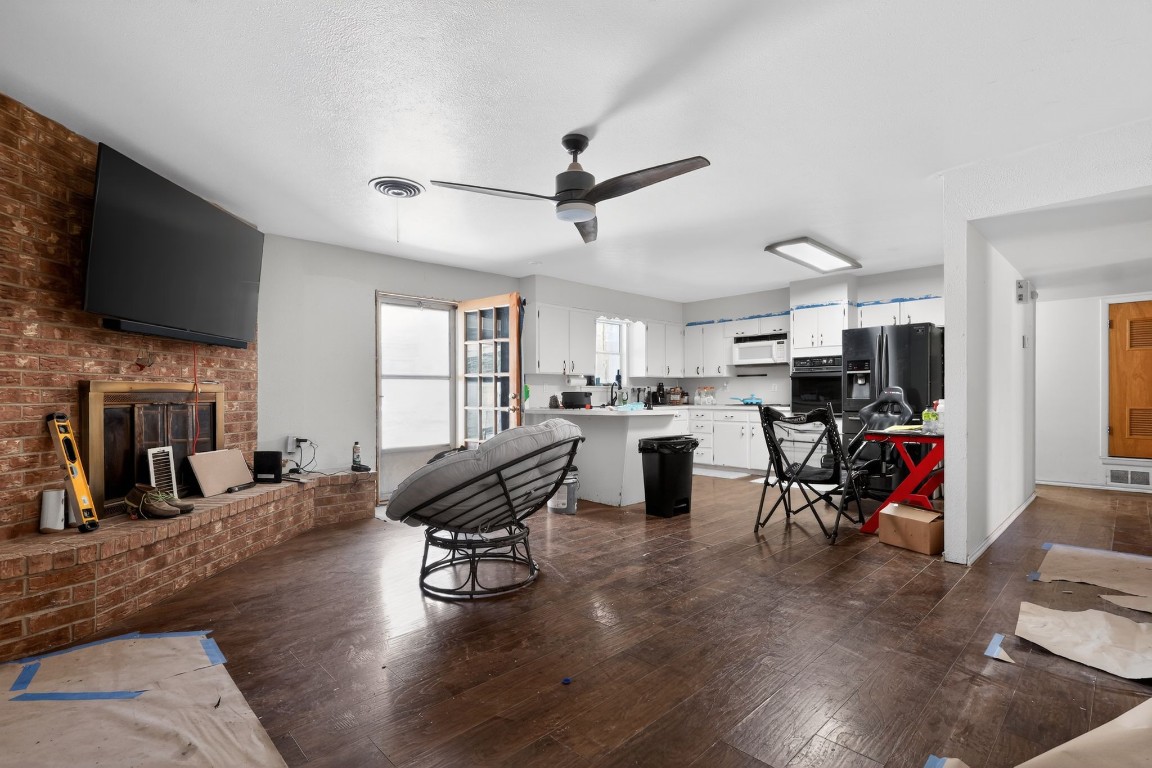 2709 Rebecca Drive Big Spring, TX 79720 - Photo 20 of 50 a living room with furniture a flat screen tv and kitchen view