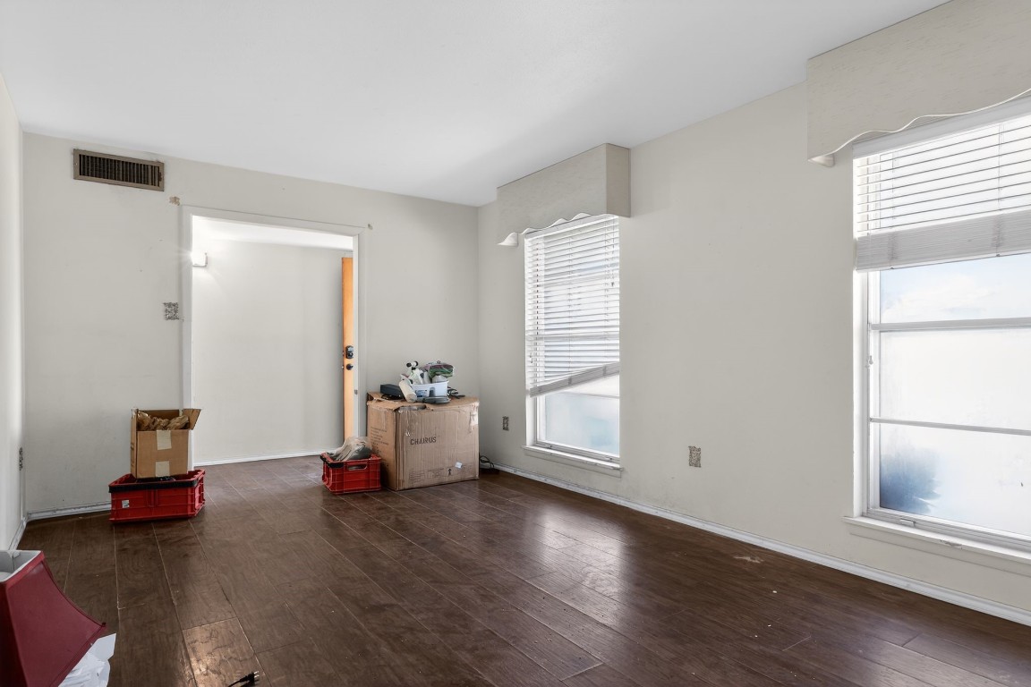 2709 Rebecca Drive Big Spring, TX 79720 - Photo 23 of 50 an empty room with wooden floor and windows