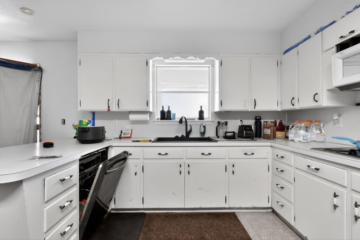 2709 Rebecca Drive Big Spring, TX 79720 - Photo 28 of 50 a kitchen with cabinets appliances a sink and a window