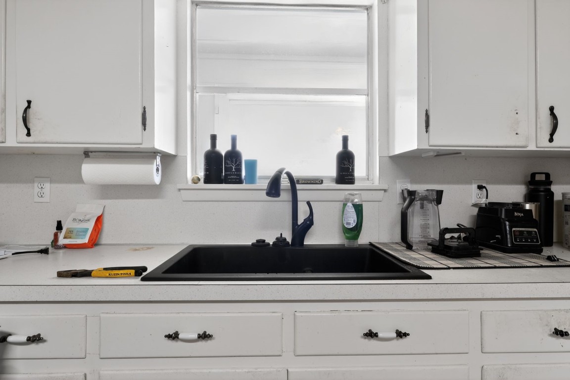 2709 Rebecca Drive Big Spring, TX 79720 - Photo 32 of 50 a kitchen with white cabinets and appliances
