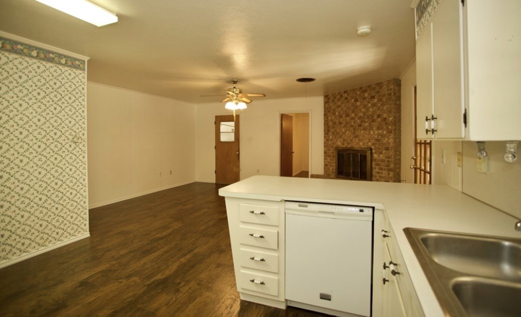 2709 Rebecca Drive Big Spring, TX 79720 - Photo 4 of 16 a view of a kitchen cabinets and a wooden floor