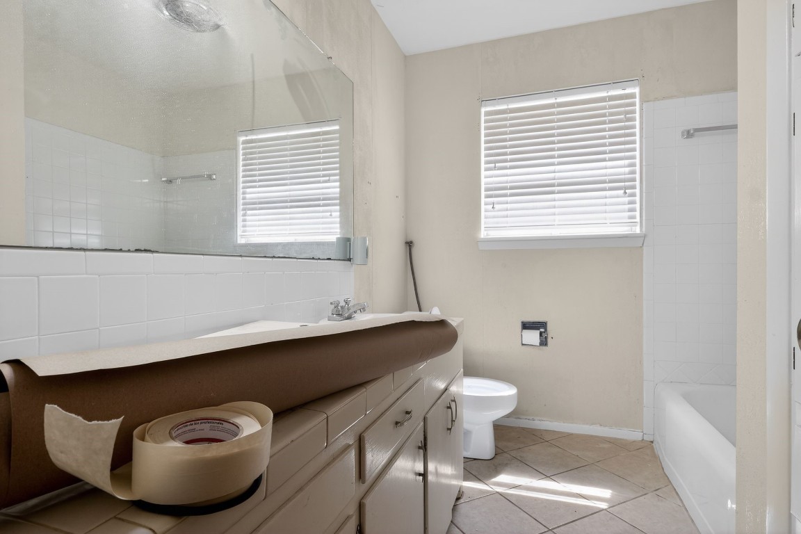 2709 Rebecca Drive Big Spring, TX 79720 - Photo 44 of 50 a bathroom with a sink and a mirror