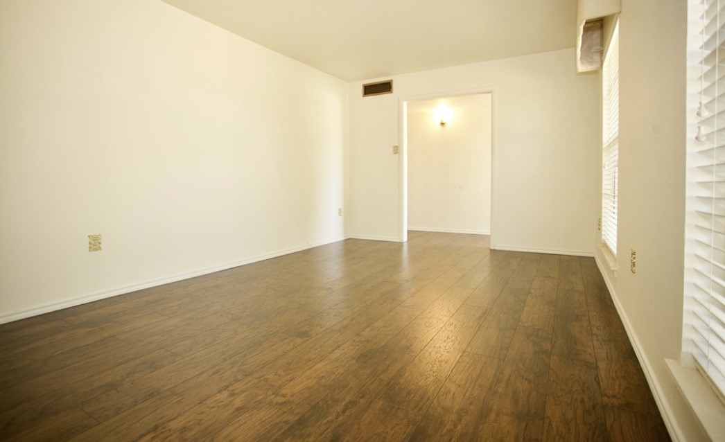 2709 Rebecca Drive Big Spring, TX 79720 - Photo 7 of 16 a view of a hallway with wooden floor