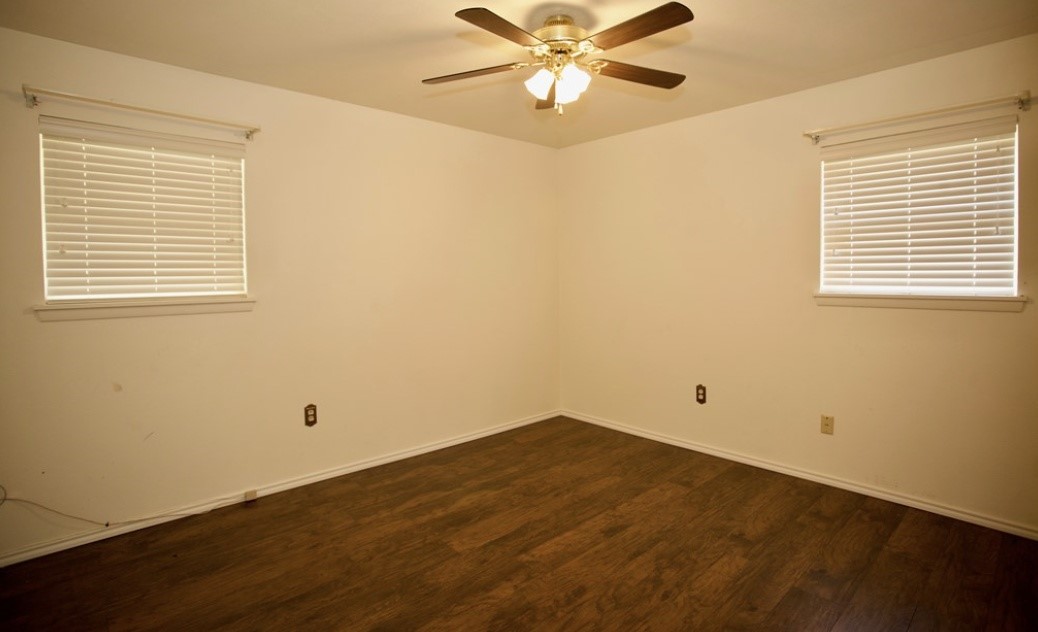 2709 Rebecca Drive Big Spring, TX 79720 - Photo 9 of 16 a view of a room with a window and wooden floor