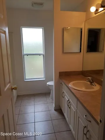 a bathroom with a sink a vanity and a mirror