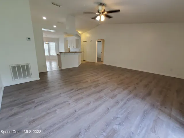a view of kitchen and hall with wooden floor and kitchen