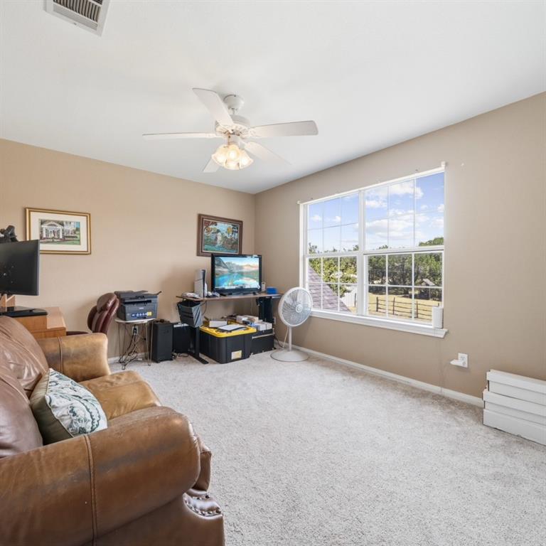 785 Tweedy Road Valley Mills, TX 76689 - Photo 25 of 40 Spacious room featuring neutral carpeting and wall tones