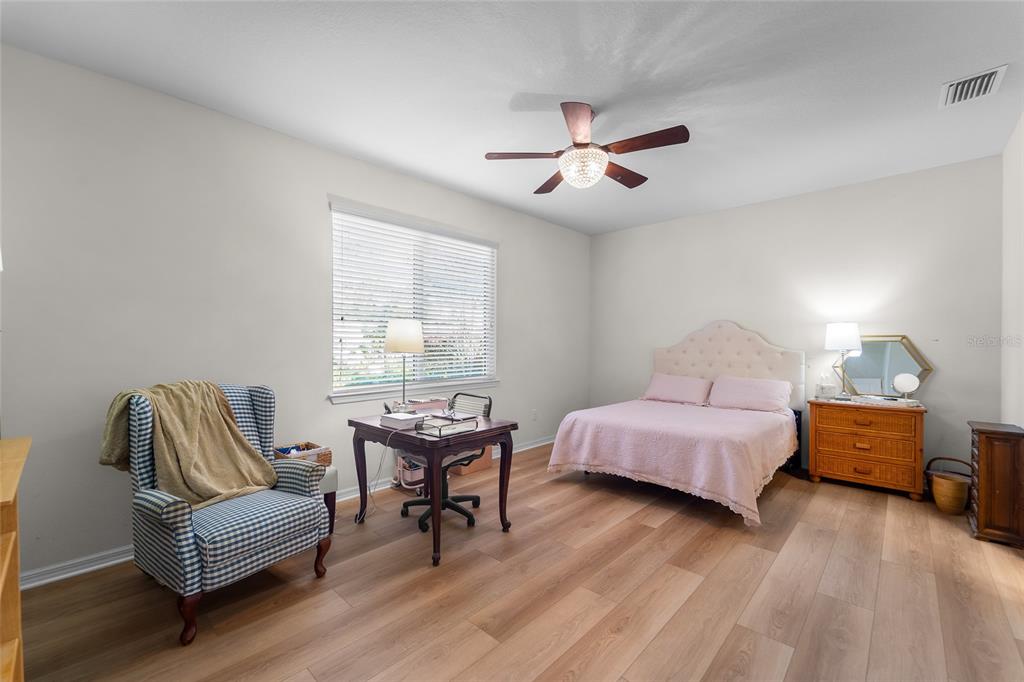 6306 Kenava Loop Palmetto, FL 34221 - Photo 11 of 31 a bedroom with furniture and a window