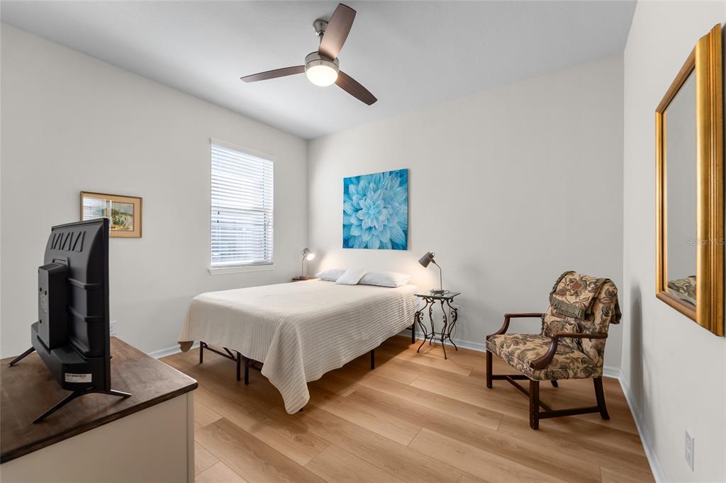 6306 Kenava Loop Palmetto, FL 34221 - Photo 14 of 31 a bedroom with a bed and a window