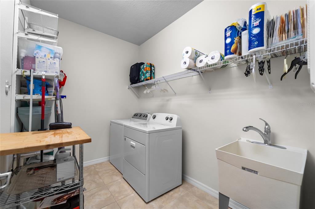 6306 Kenava Loop Palmetto, FL 34221 - Photo 23 of 31 a room with storage and utility