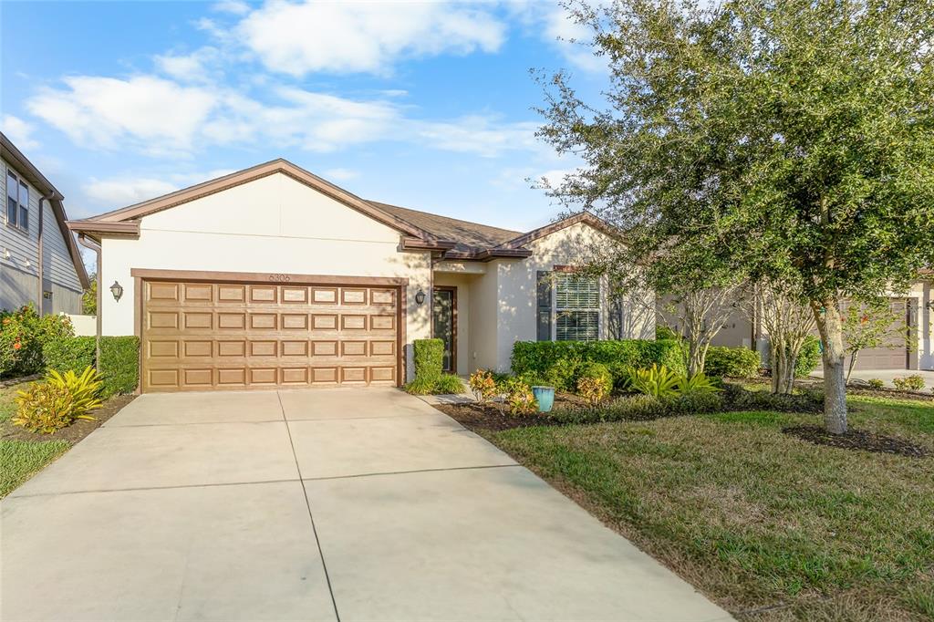 6306 Kenava Loop Palmetto, FL 34221 - Photo 26 of 31 a house view with a garden space