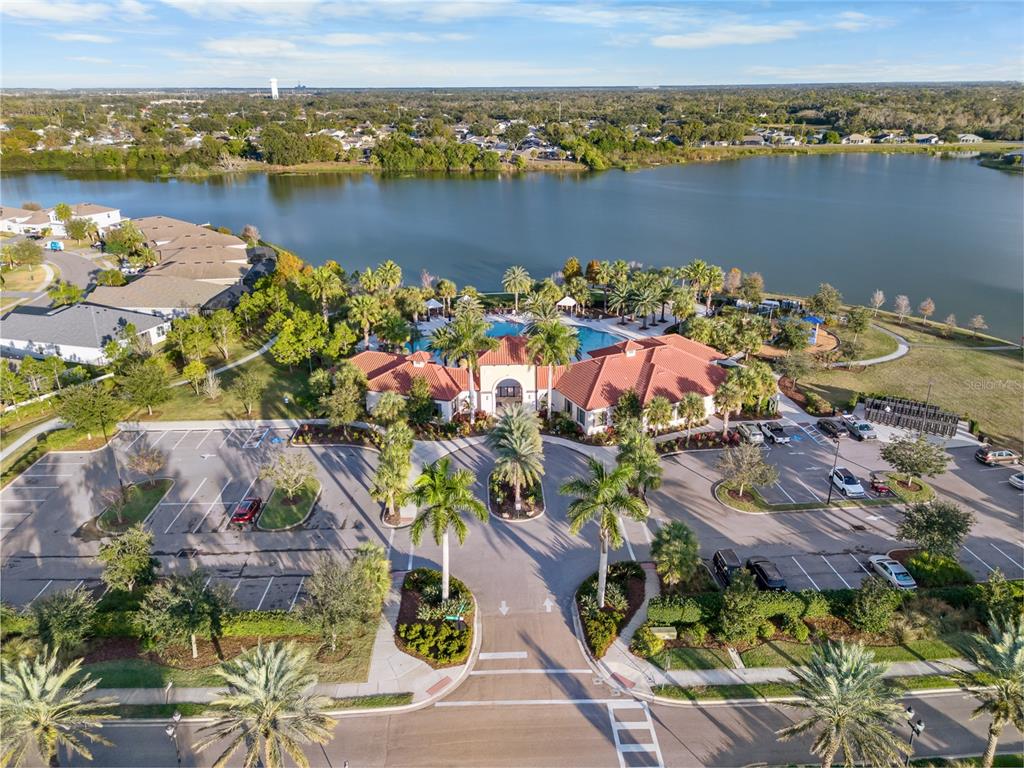 6306 Kenava Loop Palmetto, FL 34221 - Photo 28 of 31 an aerial view of lake and residential houses with outdoor space