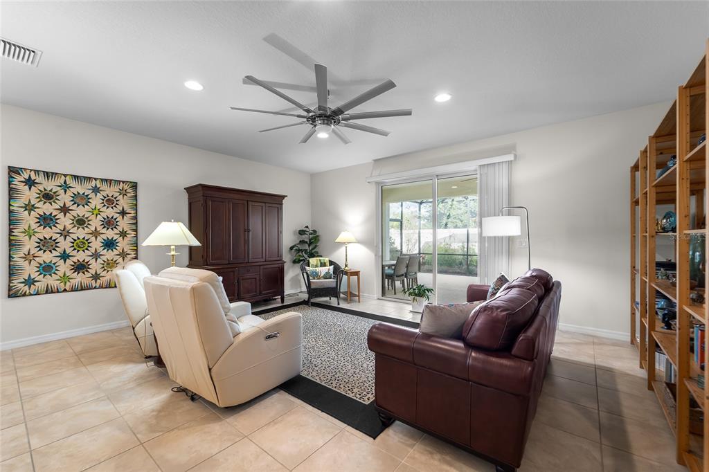 6306 Kenava Loop Palmetto, FL 34221 - Photo 8 of 31 a living room with furniture and a large window