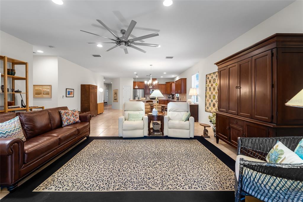 6306 Kenava Loop Palmetto, FL 34221 - Photo 9 of 31 a living room with furniture wooden floor and a rug