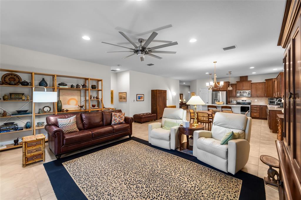 6306 Kenava Loop Palmetto, FL 34221 - Photo 10 of 31 a living room with furniture kitchen view and a table