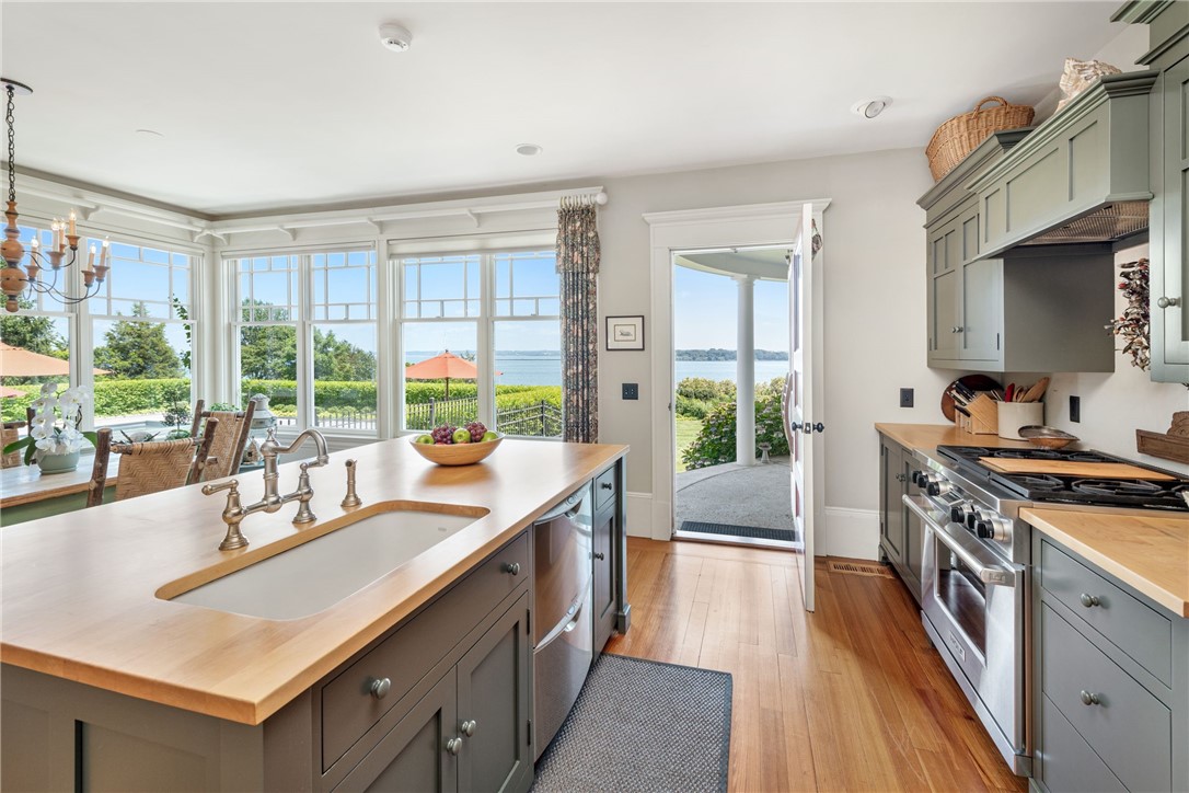 340 East Shore Road Jamestown, RI 02835 - Photo 30 of 50 KITCHEN W/VIEWS OF POOL AND BAY & OPENS TO PORCH