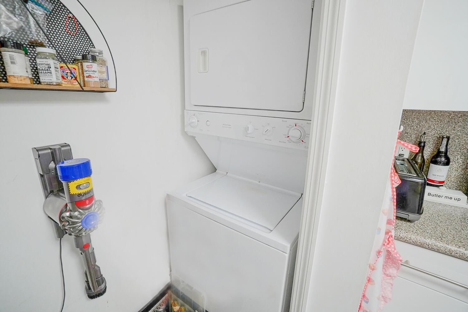 2415 Northwest 16th St Road, Unit 512 Miami, FL 33125 - Photo 13 of 17 a utility room with dryer and washer