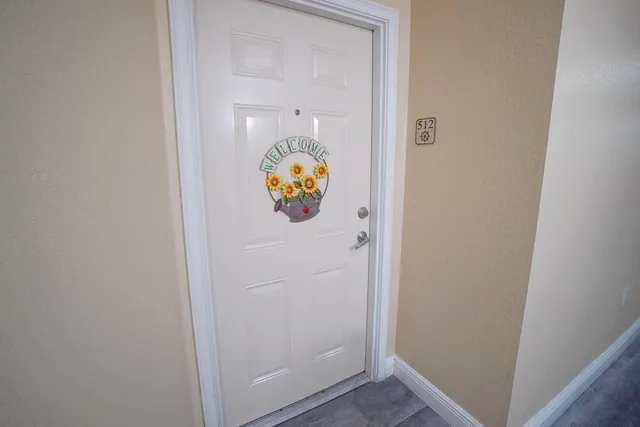 a utility room with window and stairs