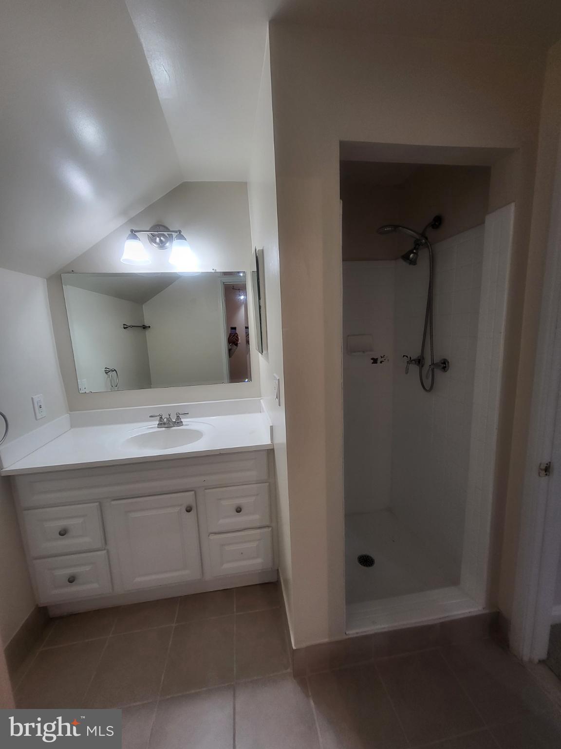 3279 South Stafford Street, Unit B1 Arlington, VA 22206 - Photo 28 of 39 a bathroom with a double vanity sink and mirror
