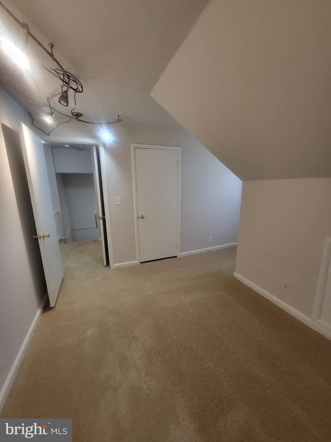 3279 South Stafford Street, Unit B1 Arlington, VA 22206 - Photo 30 of 39 en empty room with windows and entrance