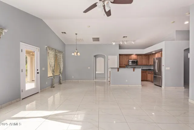 a view of a kitchen with a sink and cabinets