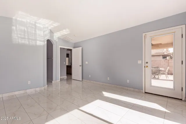 a view of an empty room and window