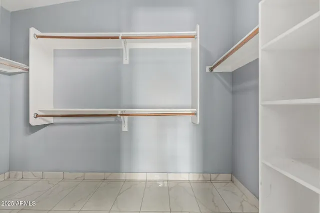 a view of an empty walk in closet