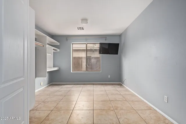 a view of an empty room with a window