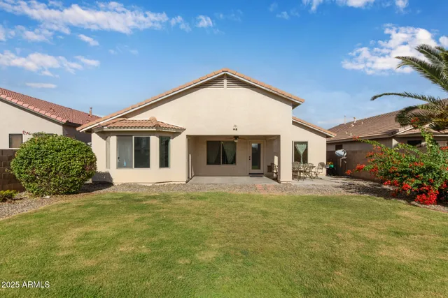 a view of a house with a yard and garage