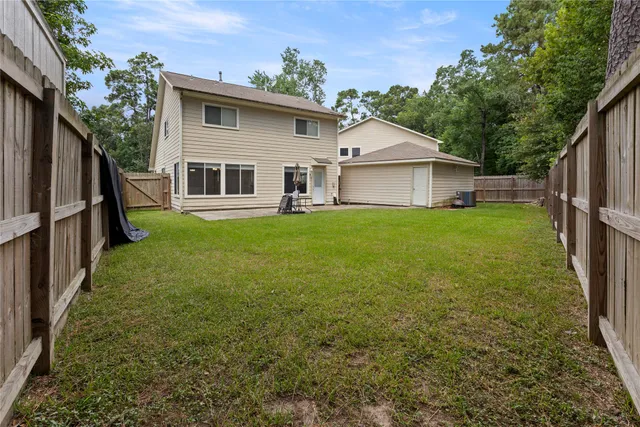 a view of a backyard of the house