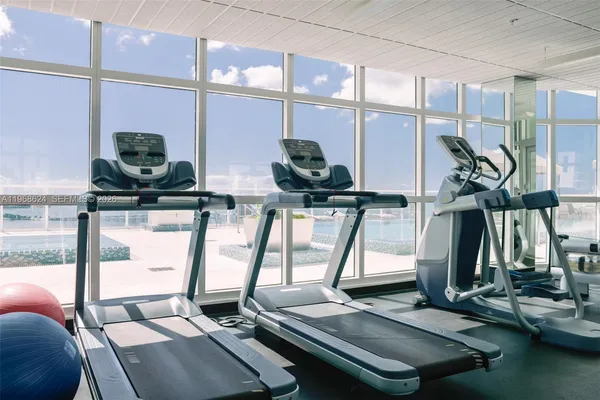 a view of a swimming pool with outdoor seating