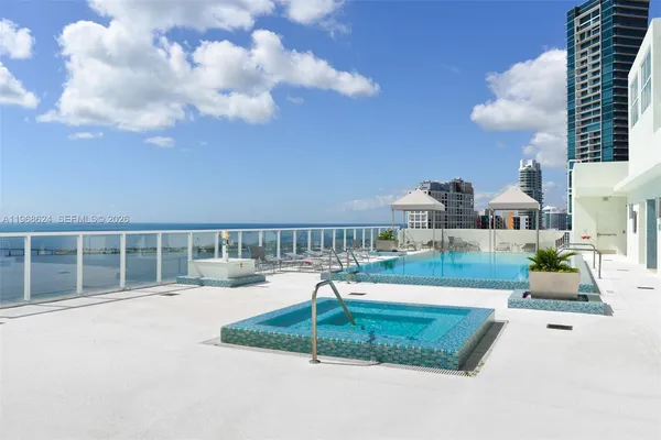 a view of a dining room with furniture and a window