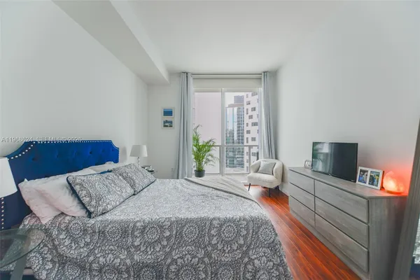 a bedroom with a bed and furniture