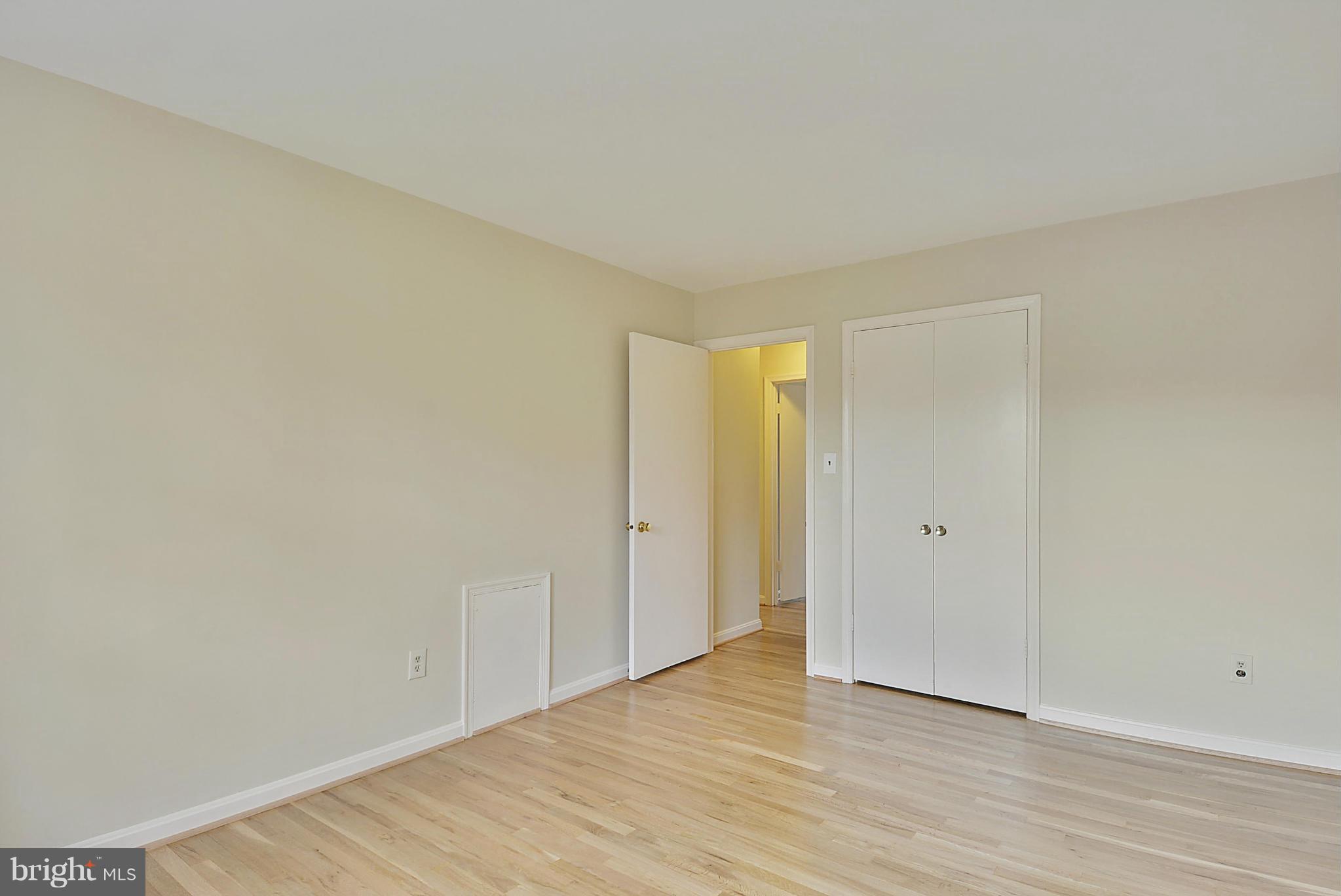 1716 Arbor View Road Silver Spring, MD 20902 - Photo 22 of 30 a view of an empty room and wooden floor